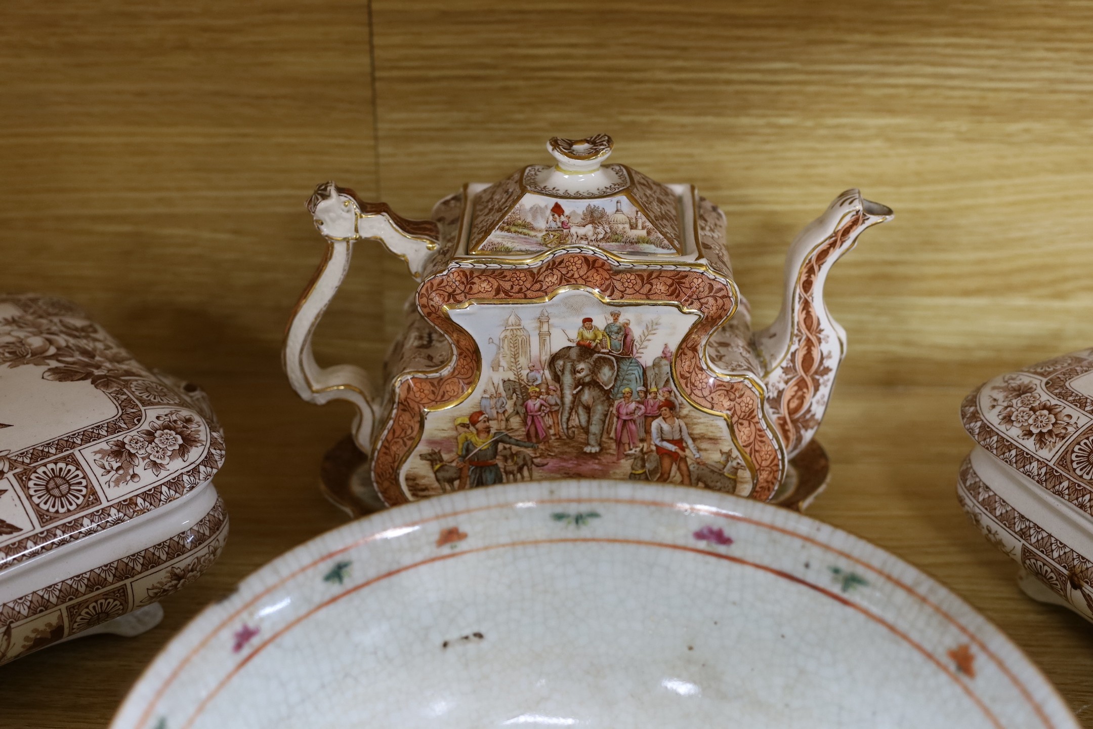 A group of mixed ceramics and an enamel brush